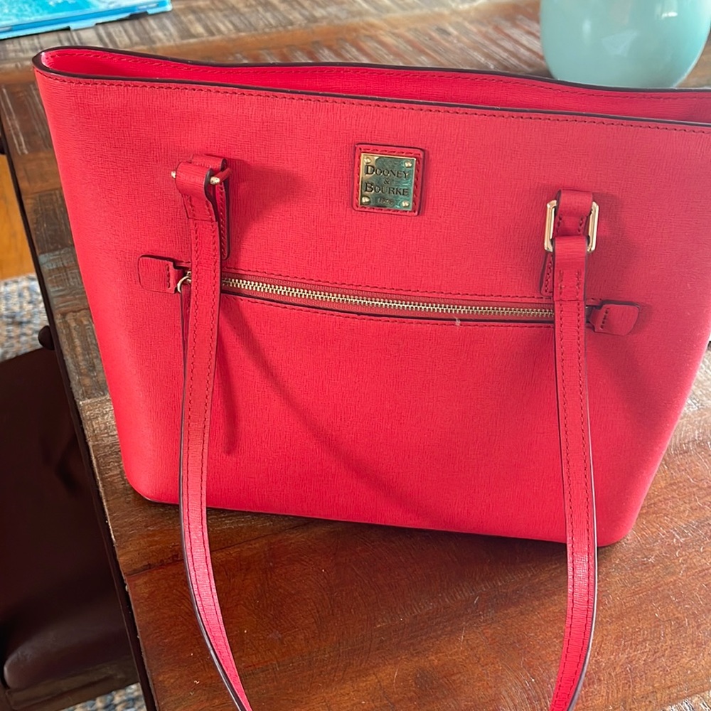 Ladies red Dooney & Burke never used shoulder Bag